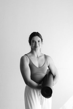 A series of black and white portraits showing a person in athletic wear posing against a white background.