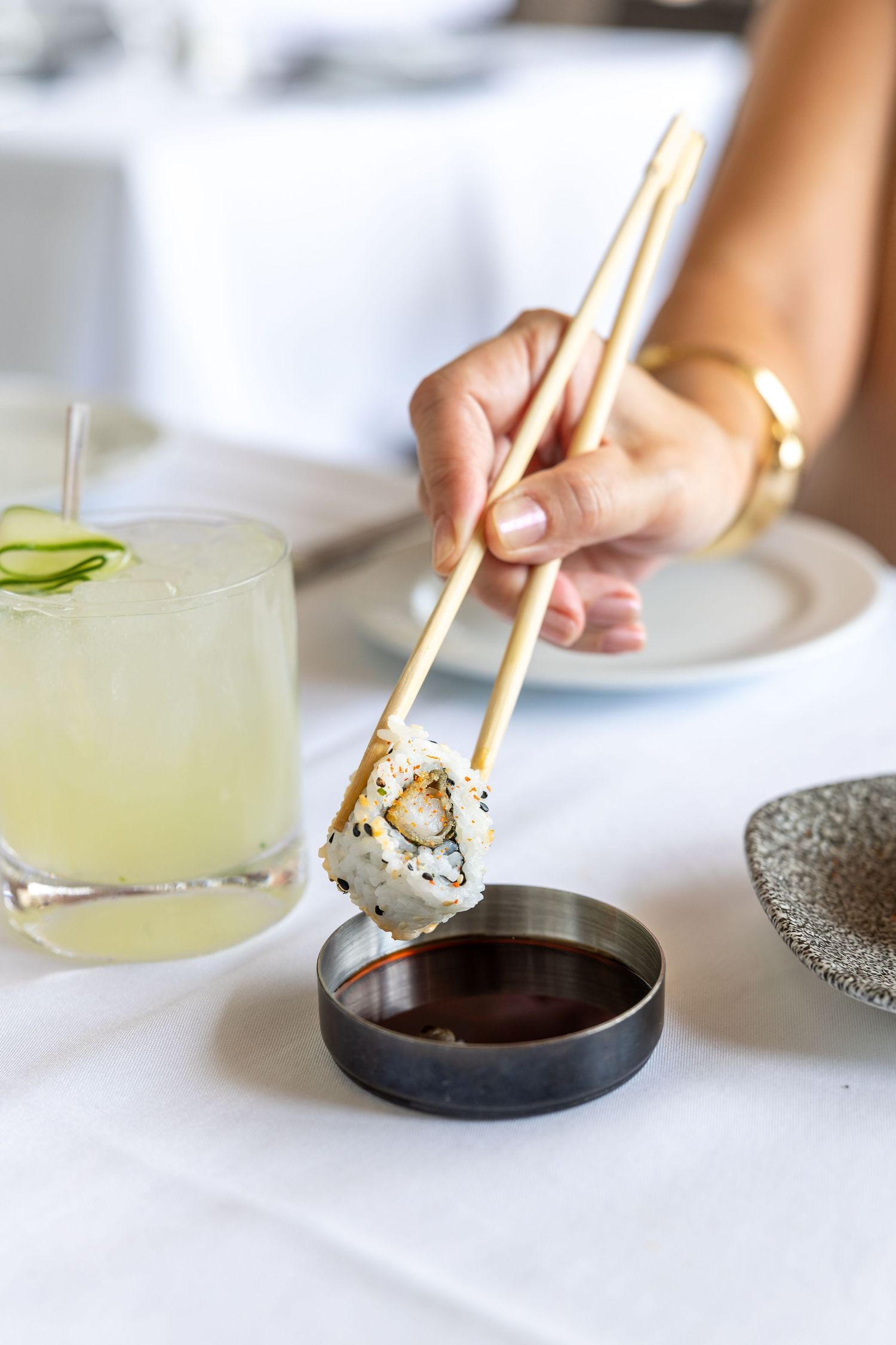 Chopsticks dipping a sushi roll into soy sauce Sarasota Commercial Food and Beverage Photographer  International Mall Tampa Photographer