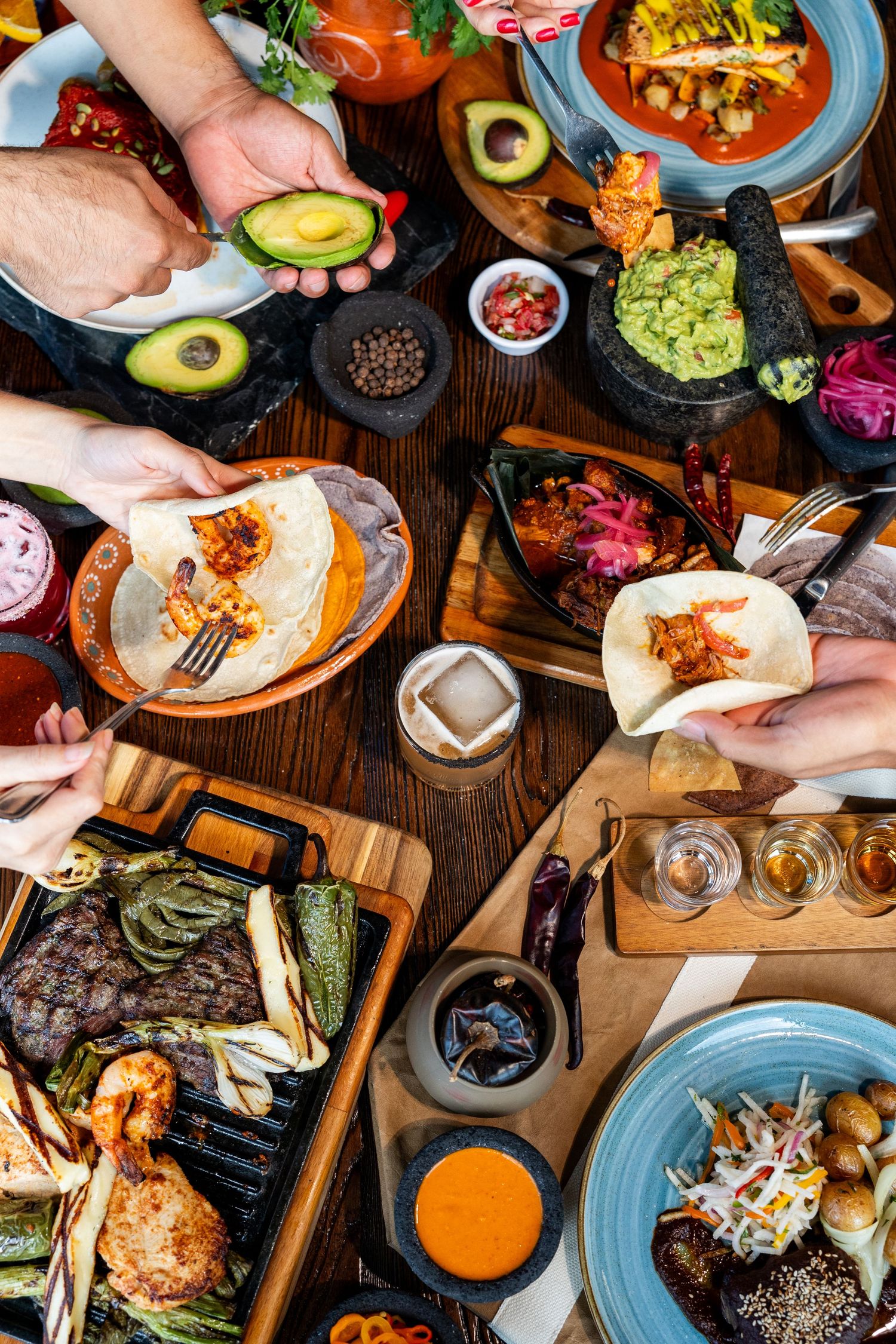 Overhead view of a colorful Mexican feast with avocados, grilled meats, tacos Sarasota Commercial Food and Beverage Photographer Menu Photo