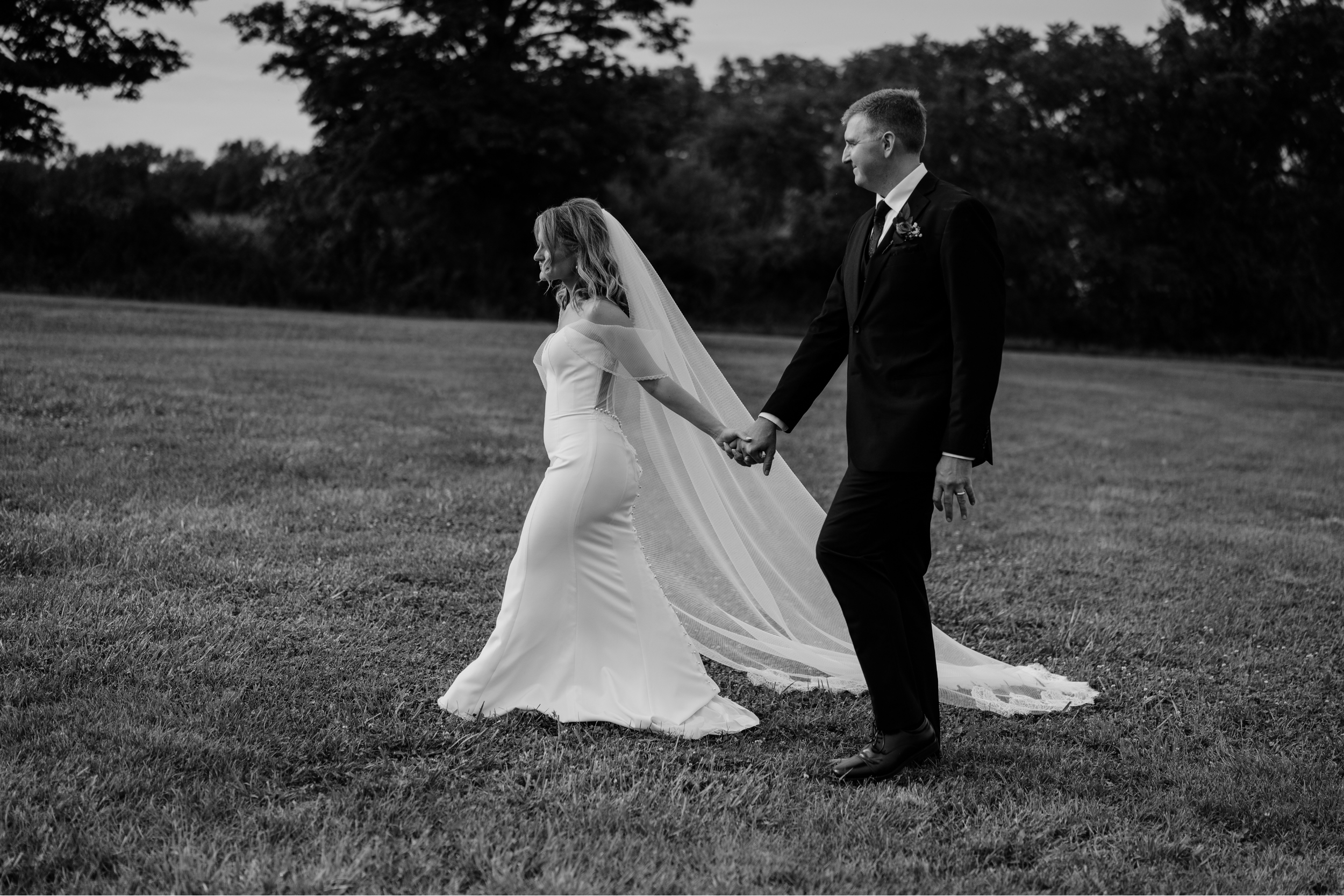 Just married couple portraits with evergreen trees in the Finger Lakes