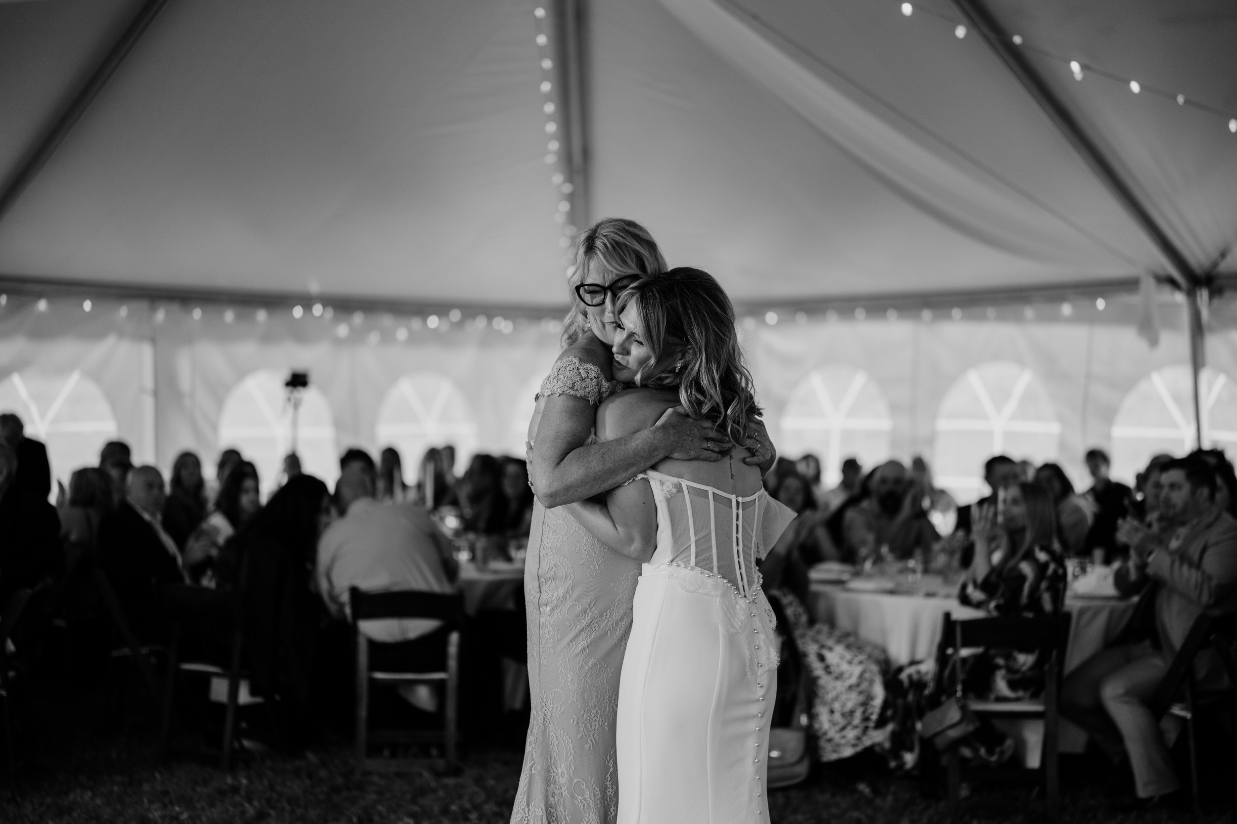 Bride and her mother dancing together during reception at Finger Lakes wedding