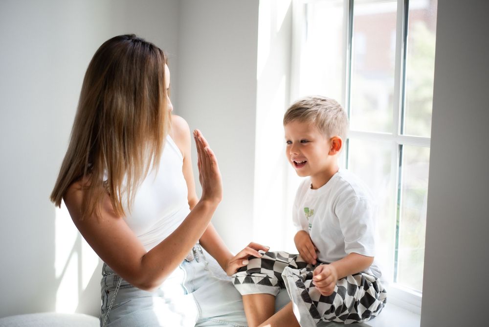 mother and child candid moment window light Nashville portrait photographer