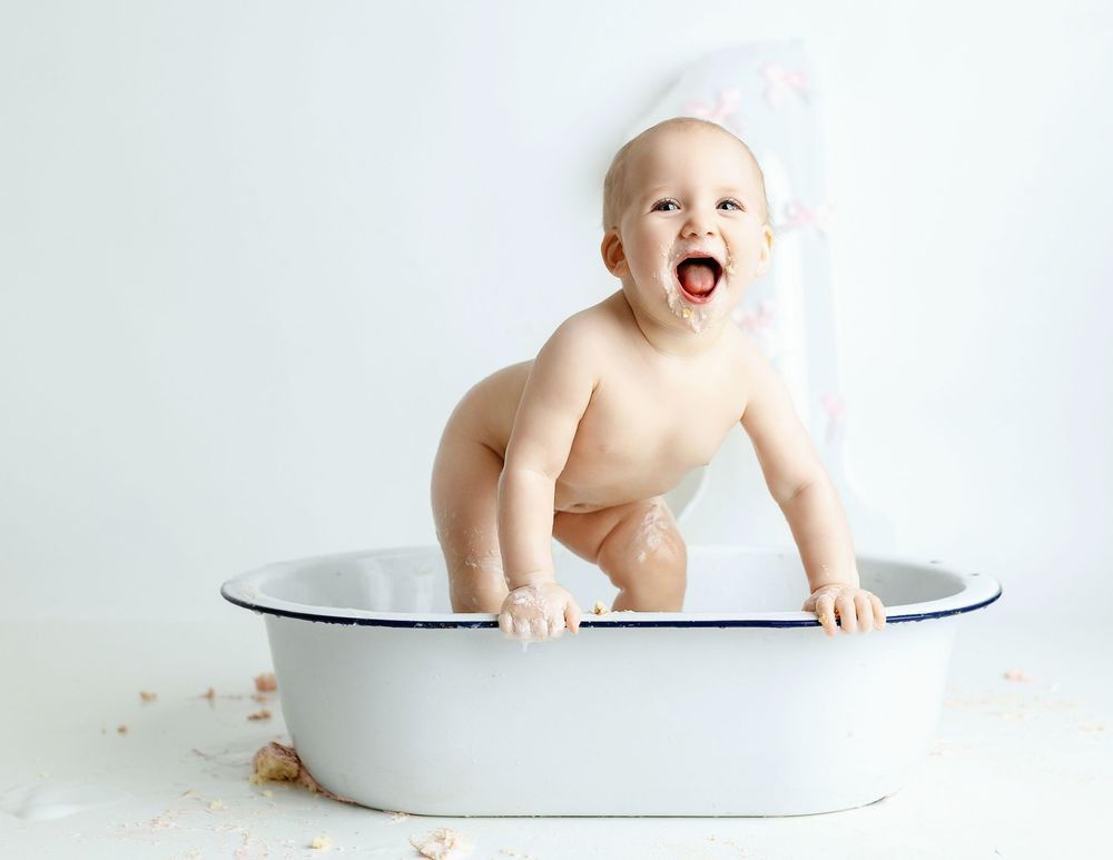 Little girl splashing. Greenville, SC newborn photographer, Easley, SC newborn photographer, Upstate SC newborn photographer