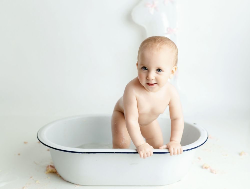 A girl standing in a tub. Greenville, SC newborn photographer, Easley, SC newborn photographer, Upstate SC newborn photographer
