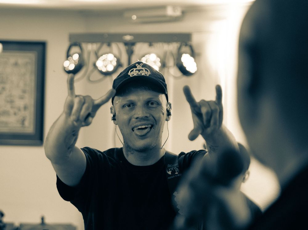Black and white photo collage showing someone making excited facial expressions and gestures in different frames.
