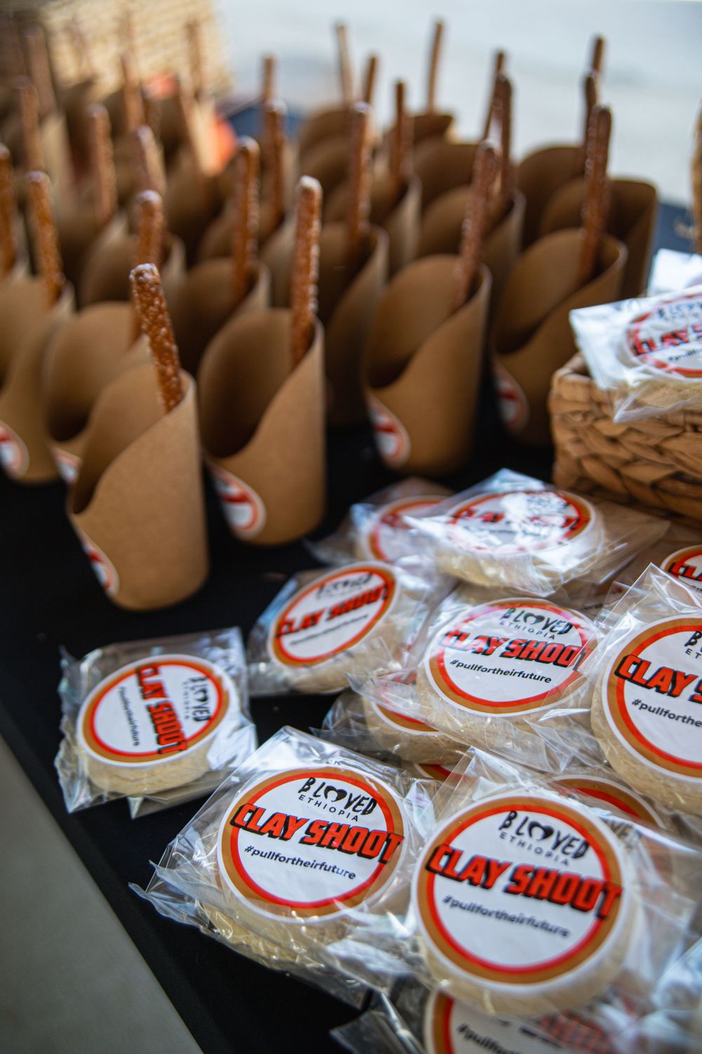 Rows of packaged food items with branded stickers arranged for service.