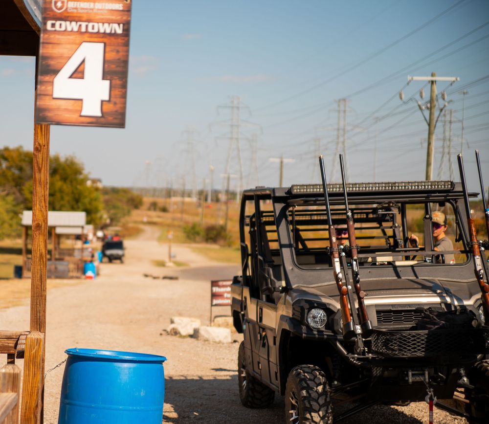 Utility vehicle parked near power lines with a station number 4 sign visible.