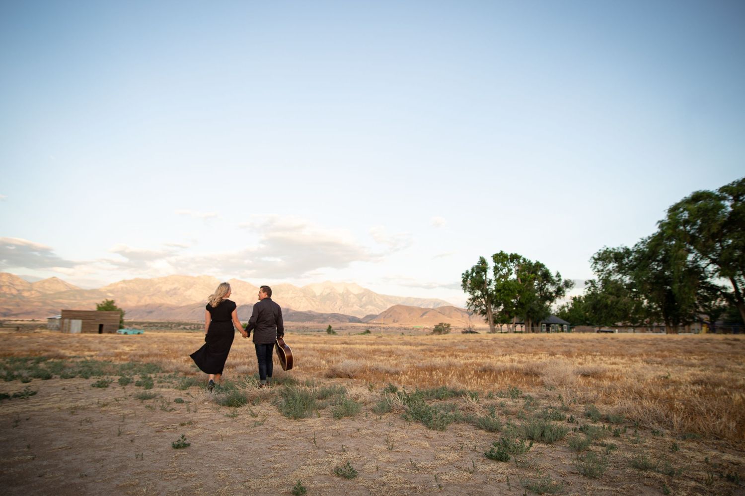 couple holding hands with guitar album cover Elberta Utah