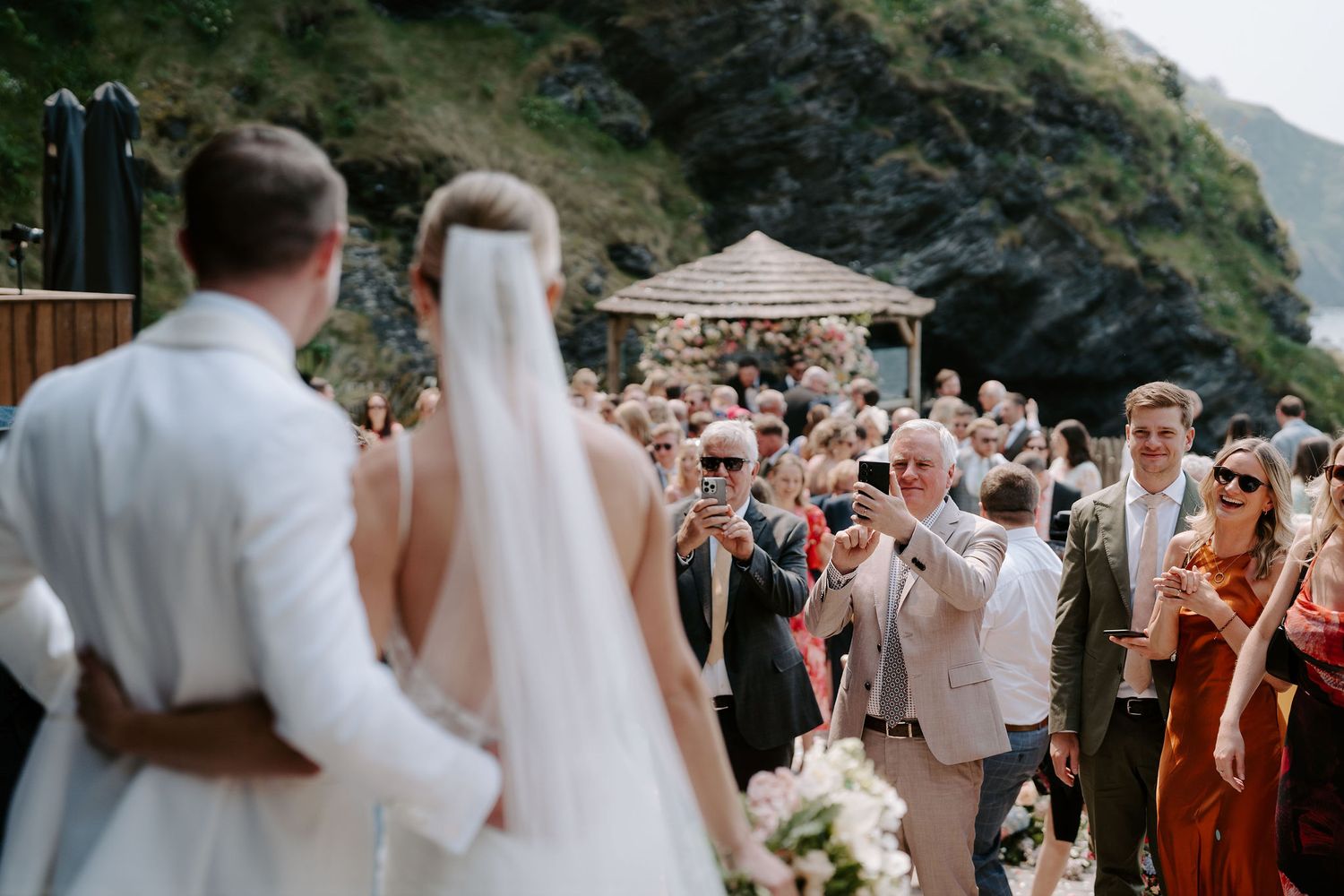 Bride and Groom and wedding guests at Tunnels Beaches in North Devon