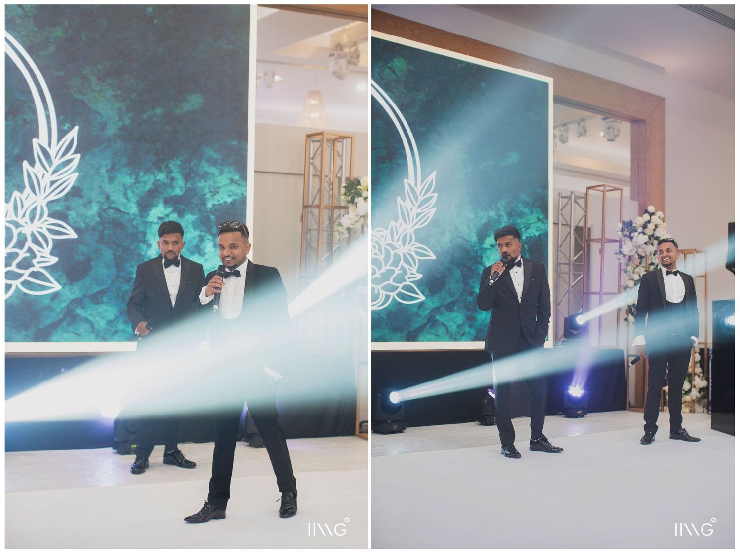Two performers in black suits entertaining guests at an elegant event with turquoise backdrop and decorative floral design.
