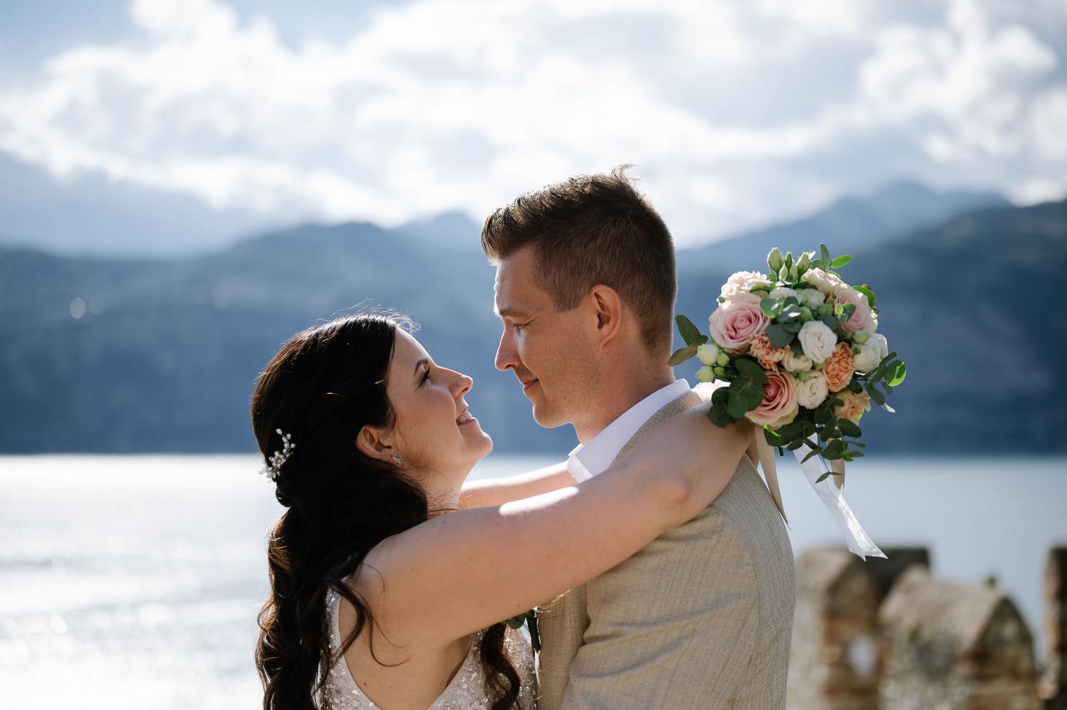 Happy newlyweds celebrating their Lake Garda wedding in Italy.