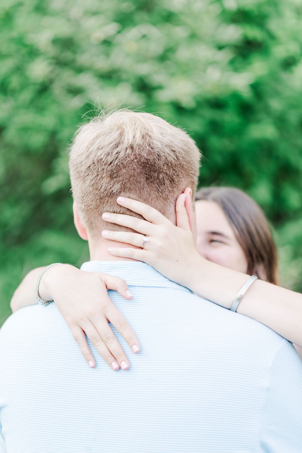 Engagement session at Quemahoning Reservoir in Johnstown Pennsylvania, close up of engagement ring while embracing head