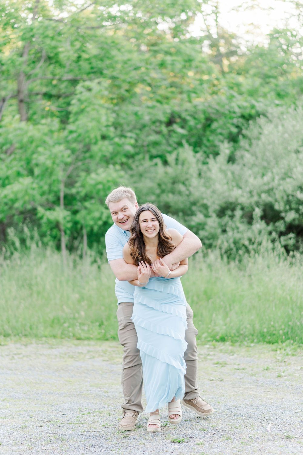 Engagement session at Quemahoning Reservoir in Johnstown Pennsylvania, surprise hug from behind
