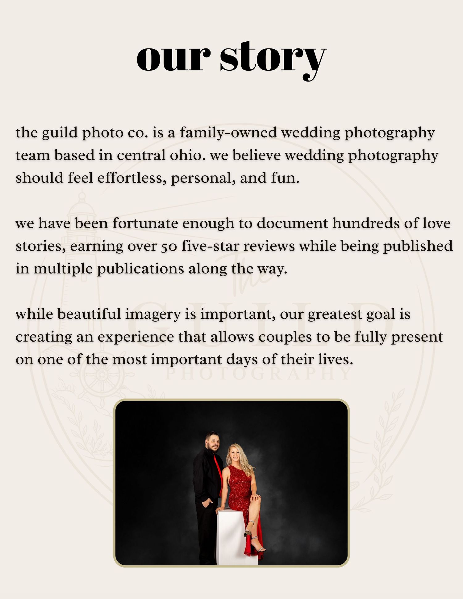 A couple poses elegantly, man in black suit and woman in red dress, for a wedding photography studio portrait.