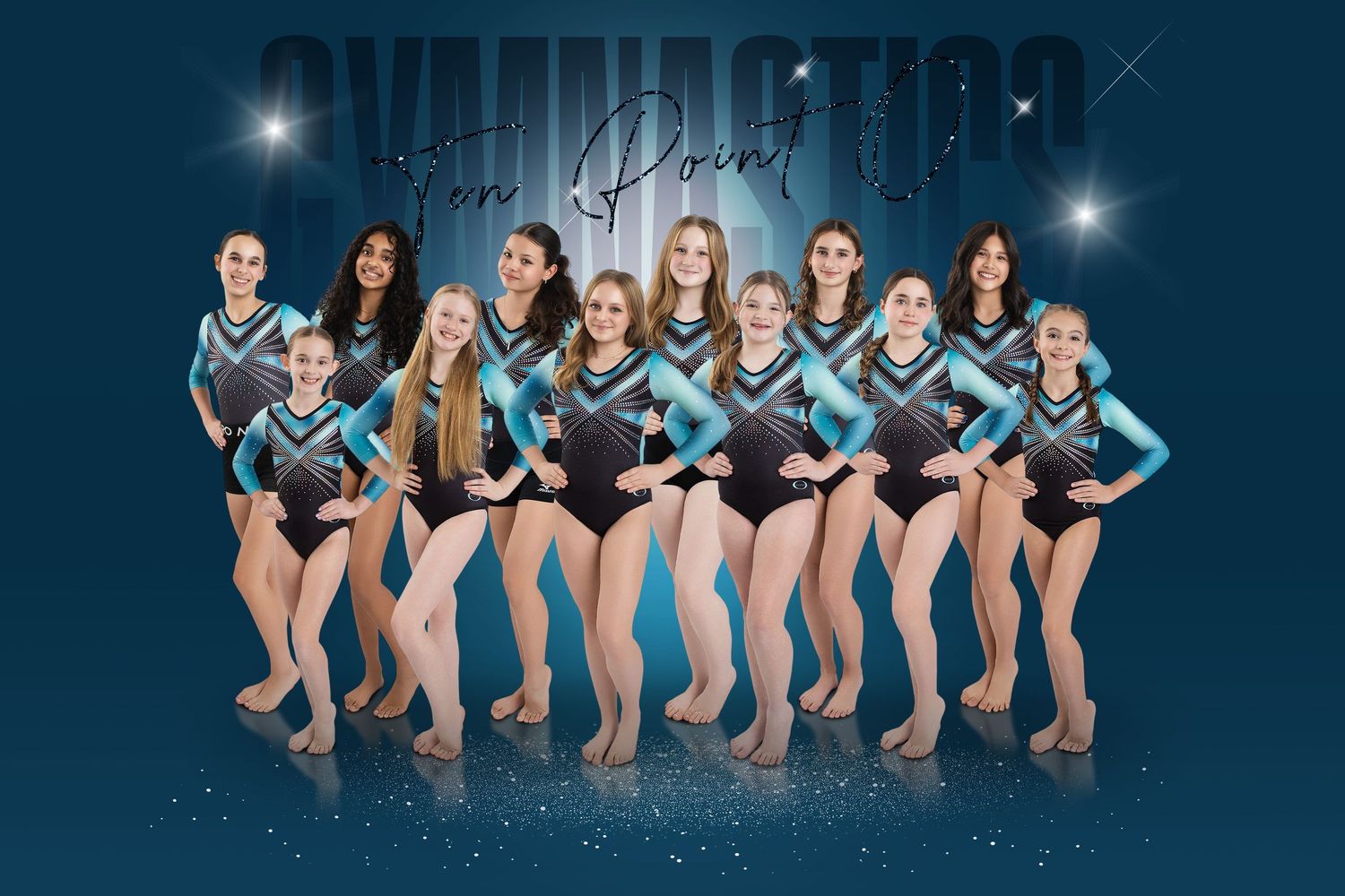 A gymnastics team poses together in teal and black leotards for a professional team photo with sparkling backdrop.