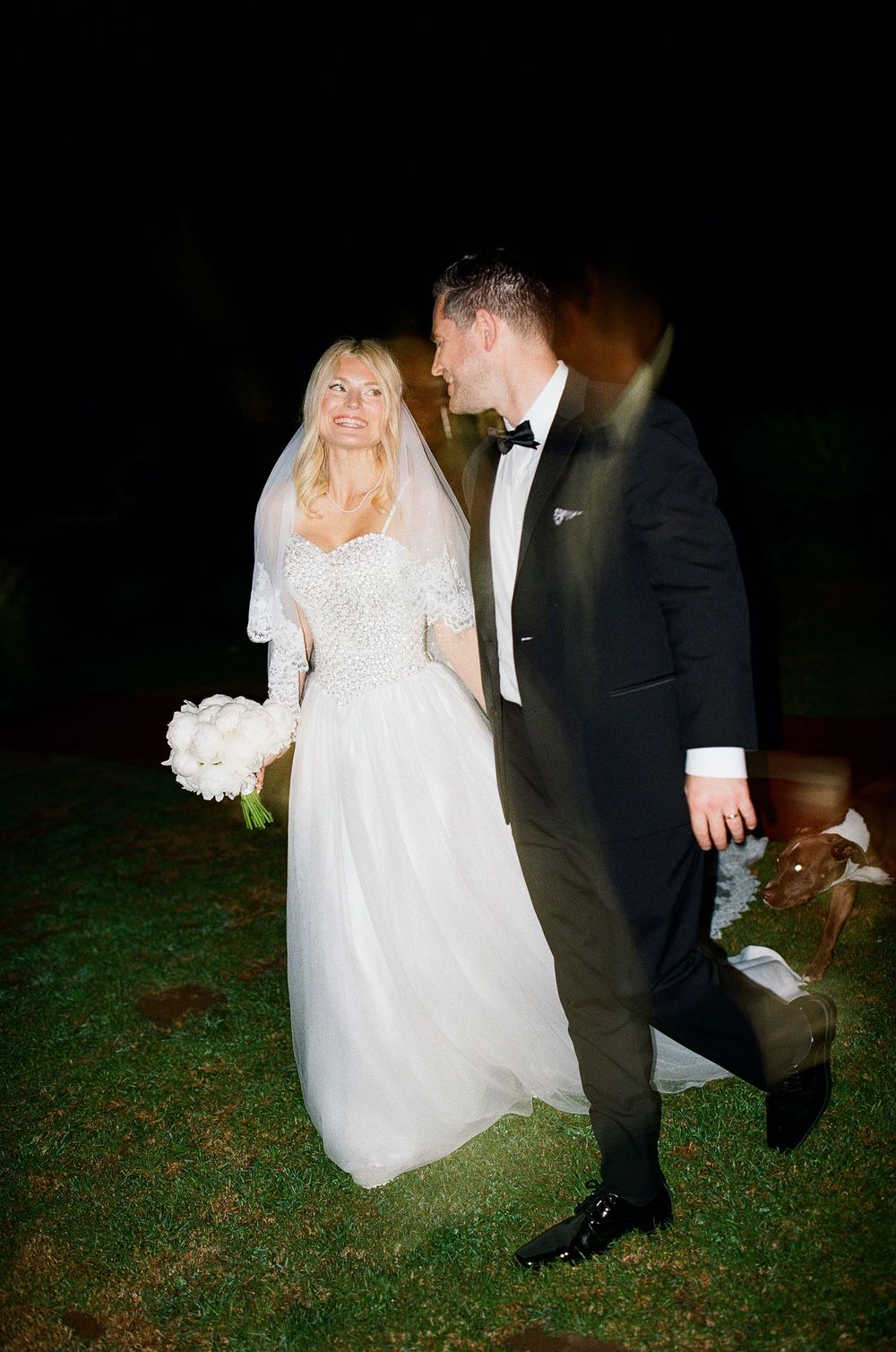 Direct flash portrait of couple in wedding attire. Modern imagery for brides.