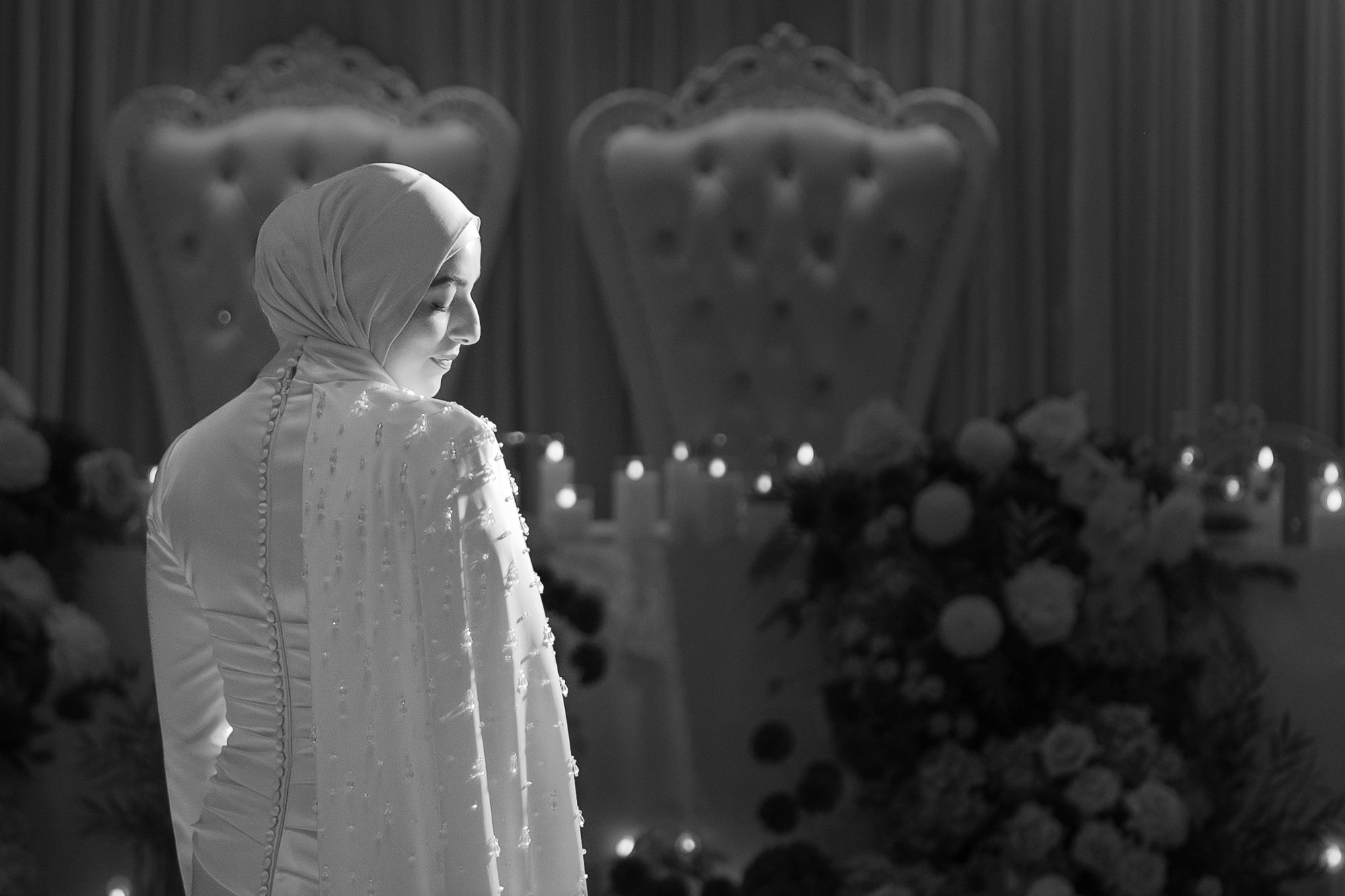 Romantic wedding venue setup with soft lighting and floral decorations.