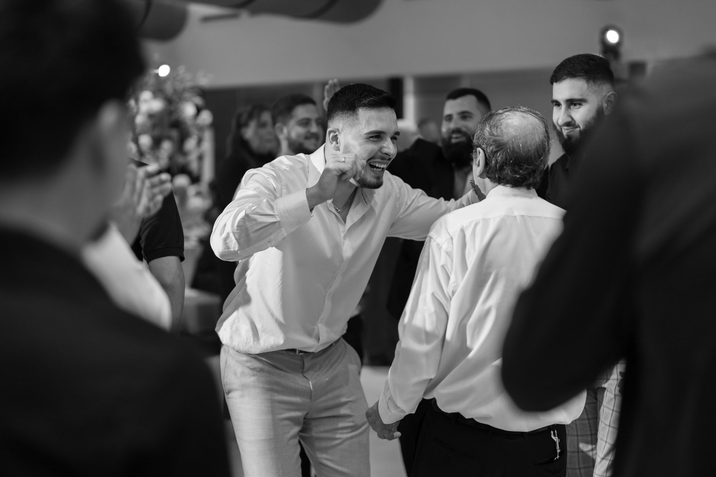 Black and white wedding reception dance moments captured in sequence.
