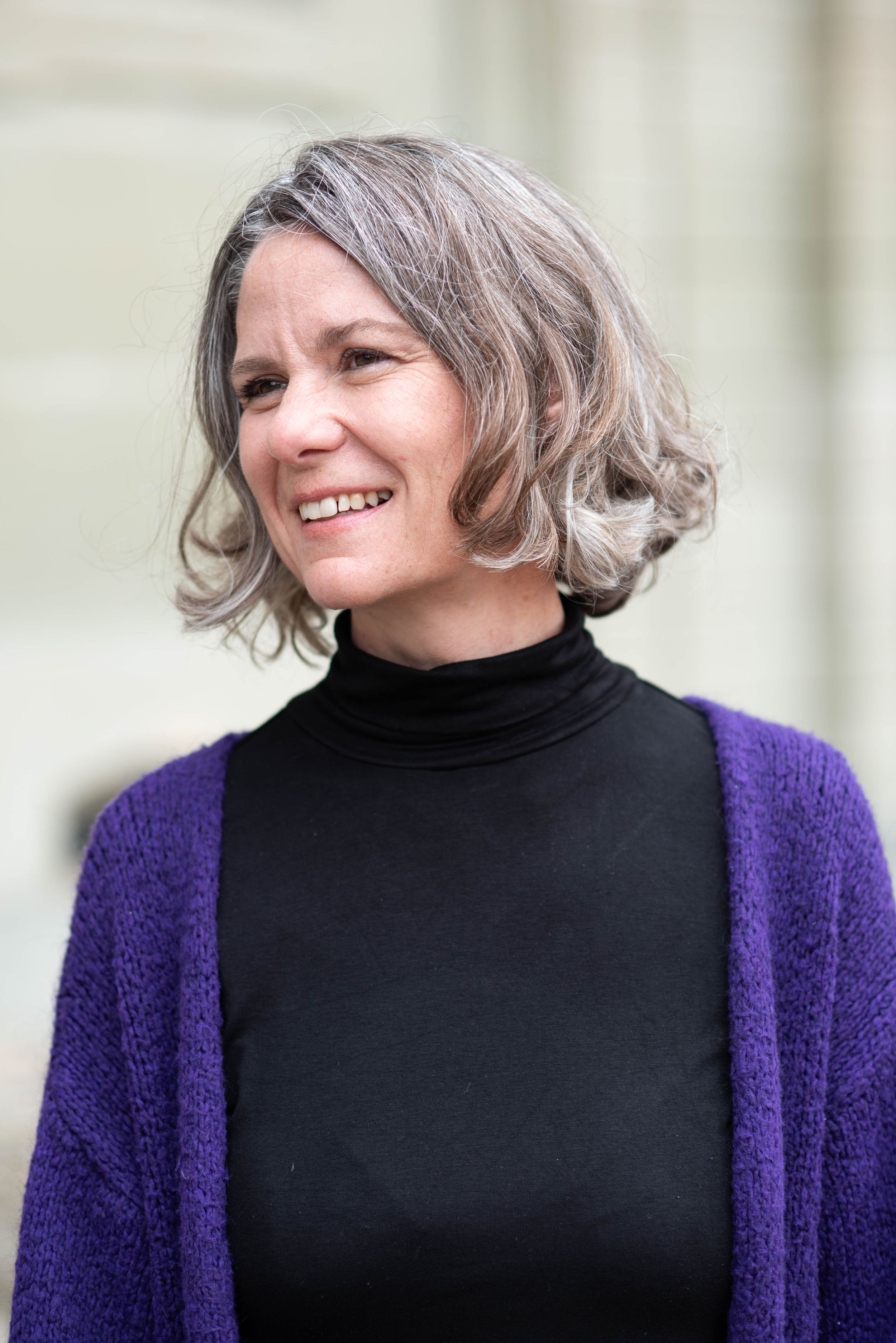 Series showing someone in purple cardigan and black turtleneck with candid expressions.