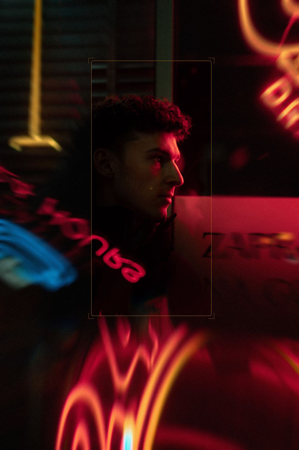 A dark moody scene with red neon lighting casting shadows in a nightclub or bar atmosphere.