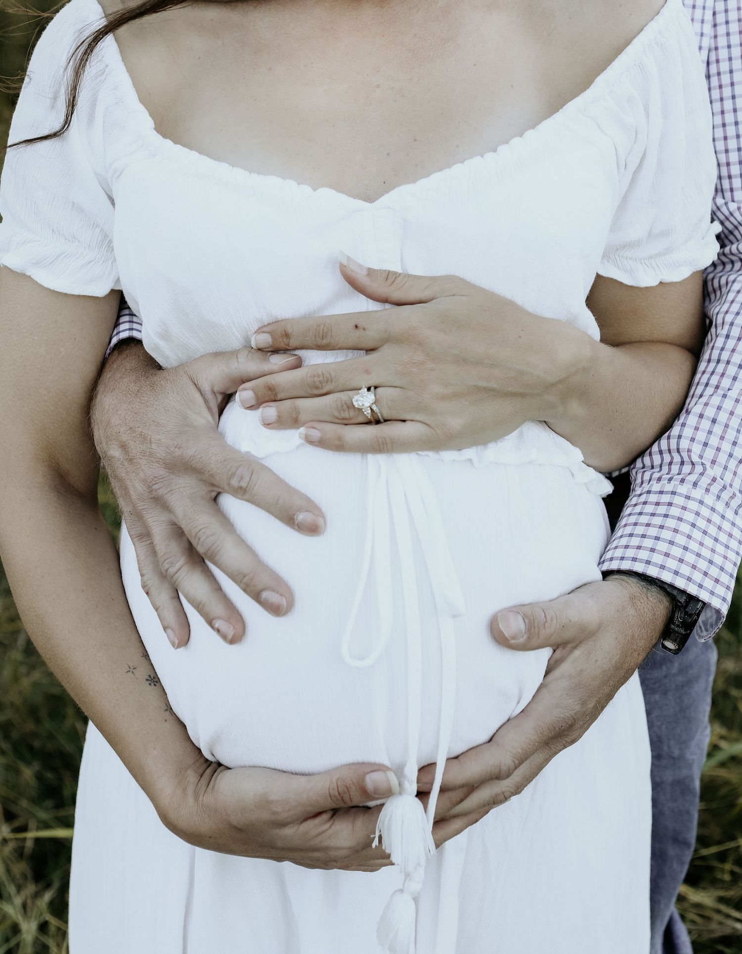 Holding the bump during a mothers day session