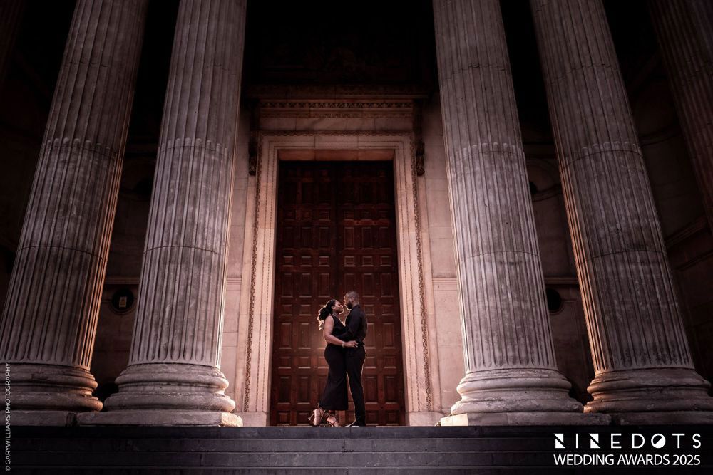 Stone columns of a historic building create a dramatic architectural pattern in low light conditions.
