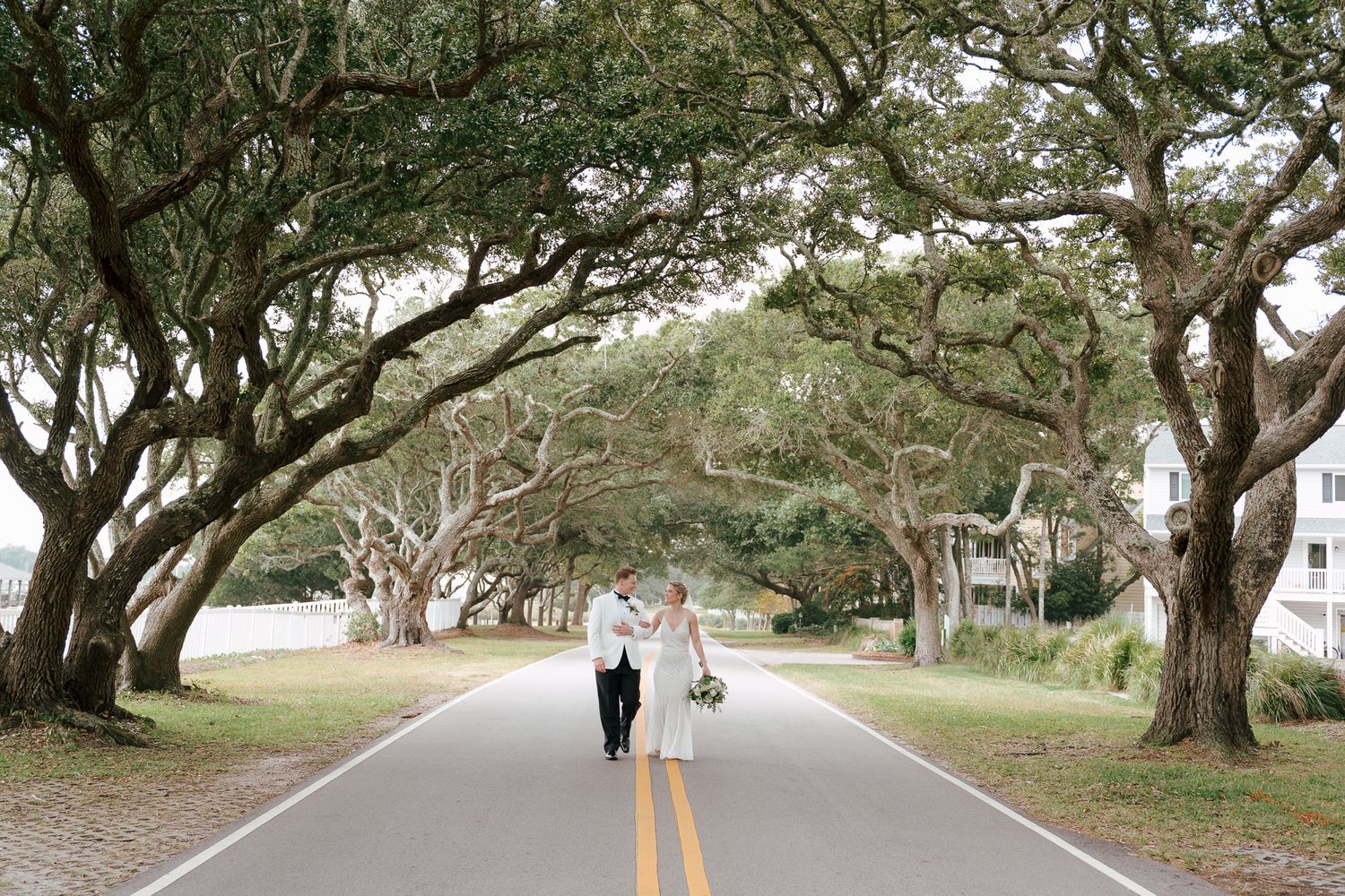 Brides on their wedding day getting portraits under the iconic oak trees in Beaufort, NC - Same Sex wedding Photographer - LGBTQ+ Wedding