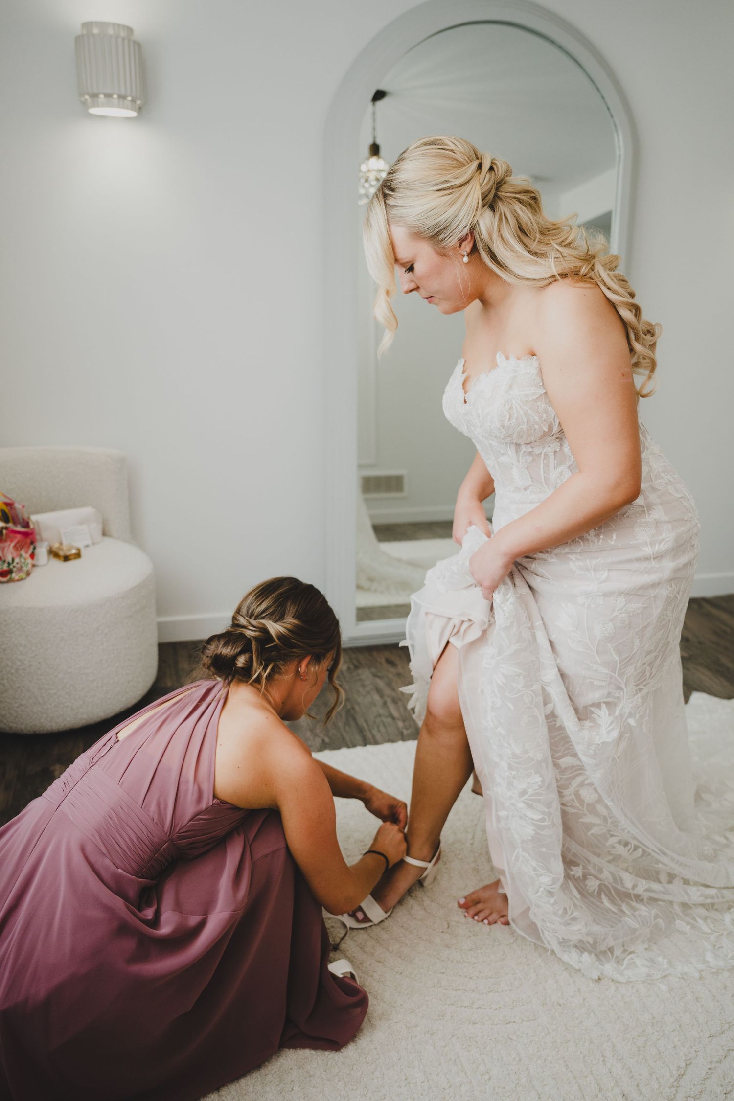 A black and white photo collage shows people getting ready for a wedding celebration in various indoor settings.