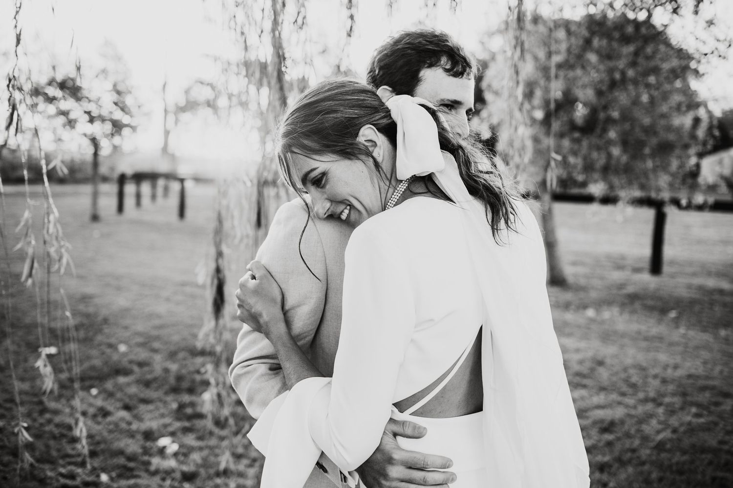 Romantic outdoor wedding portraits in a natural setting.