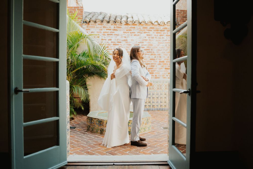 A series of four wedding photos showing a bride in a white dress against a brick wall and courtyard setting.