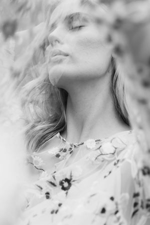 Soft focus black and white close-up portrait with ethereal dreamy lighting effects.