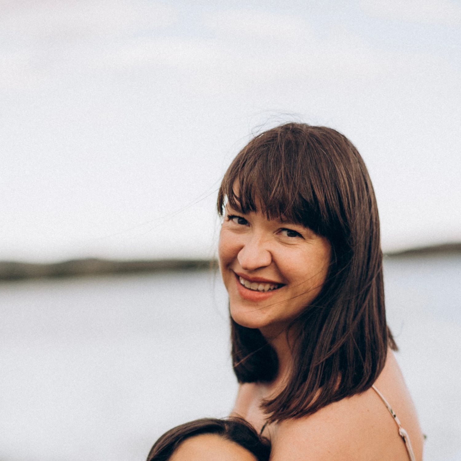 Series of outdoor portraits capturing joyful expressions against a bright background.