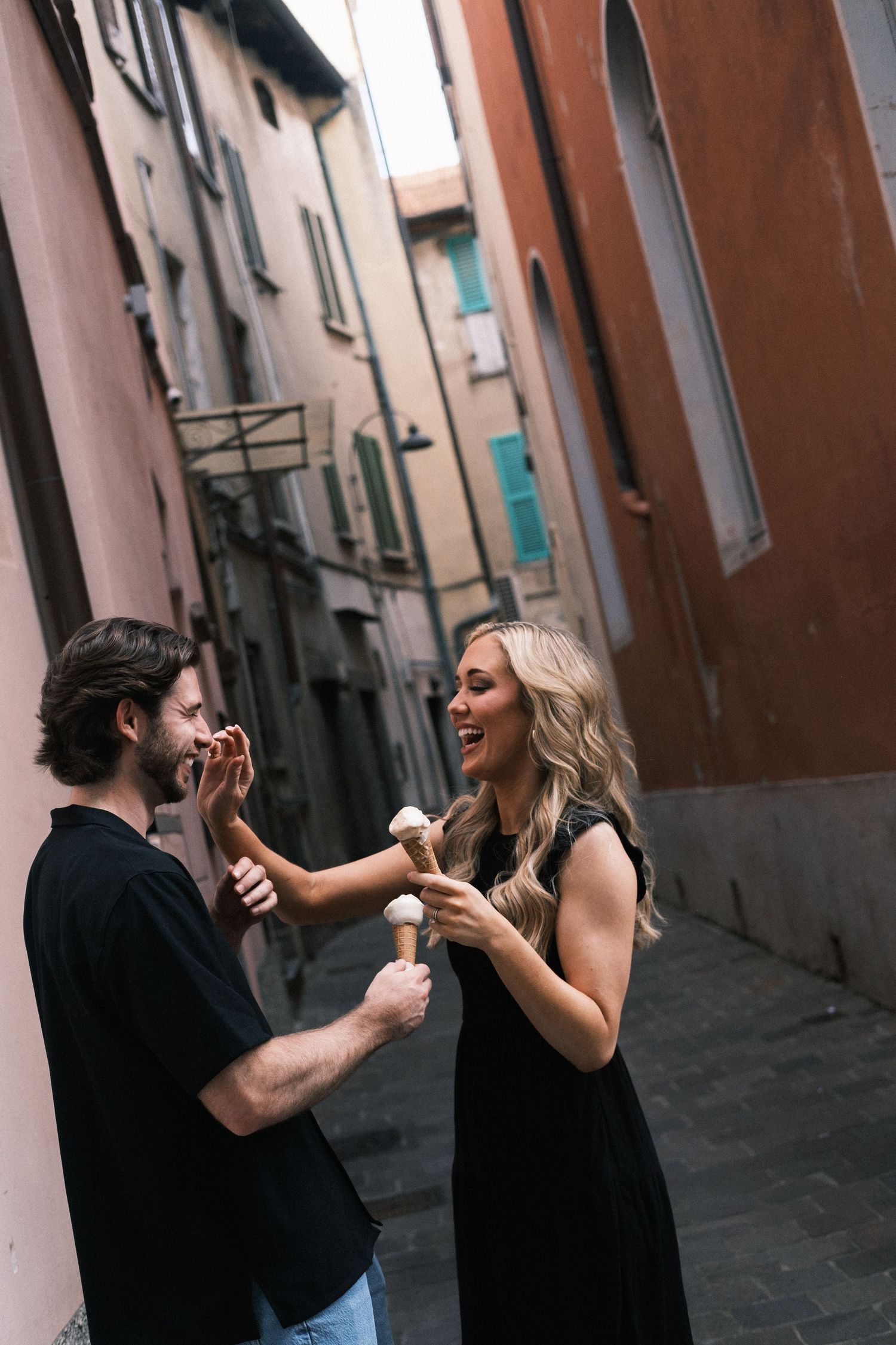 Couple sharing gelato romantic Milan side street