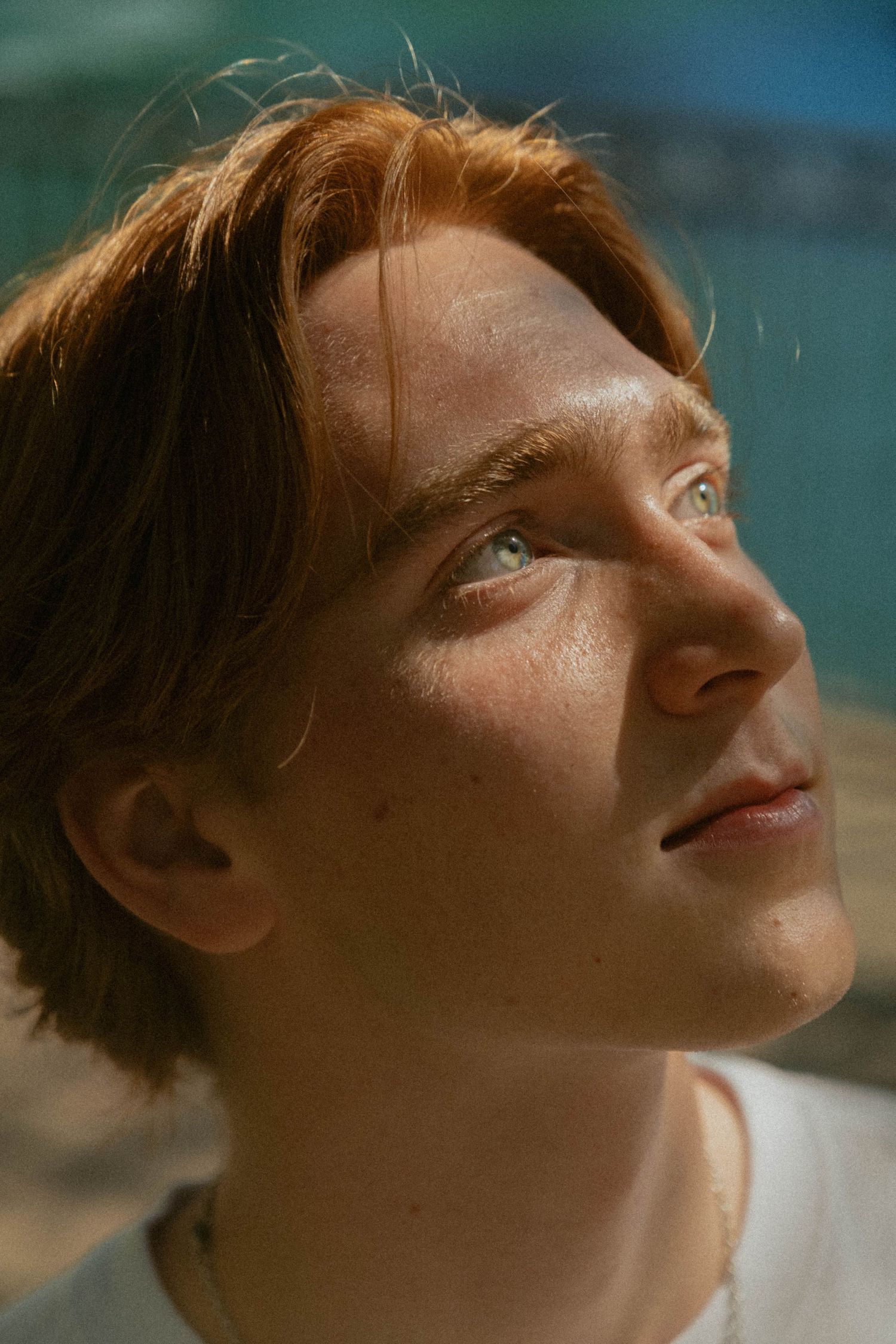 Upward gazing profile shots with dramatic lighting and focused on eye.