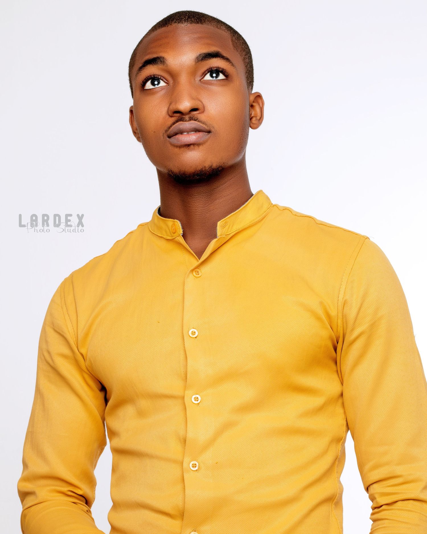 Person wearing a bright yellow collared shirt shown from multiple angles against a white background.