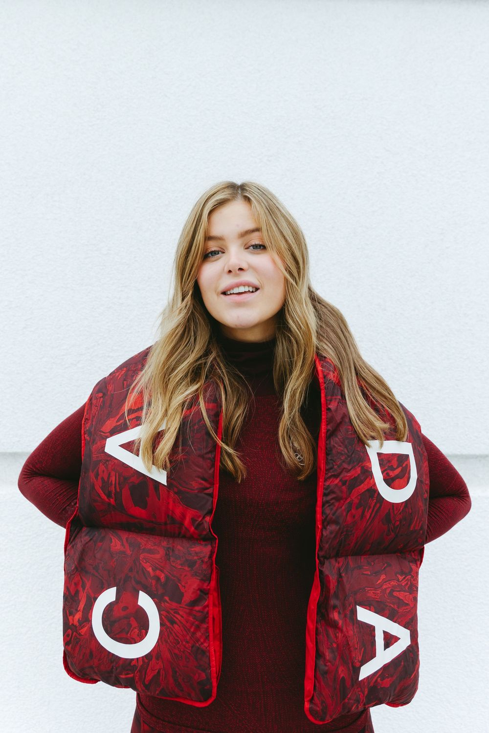 Stylish red and black patterned jacket with white text detail shown in multiple angles.