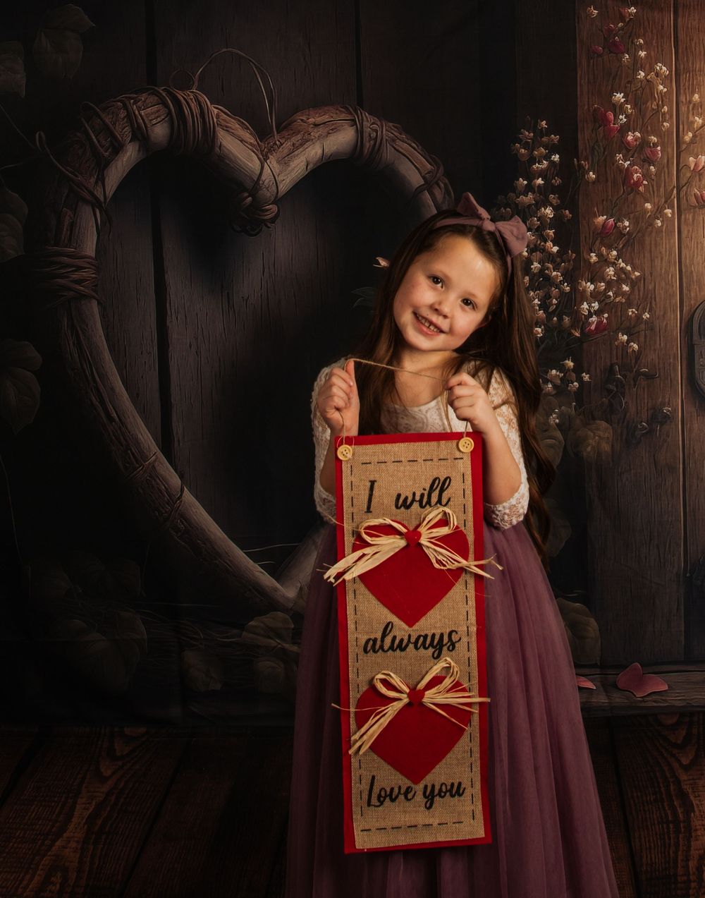 A heartwarming Valentine's scene with a rustic heart backdrop and red 'I will always love you' sign.