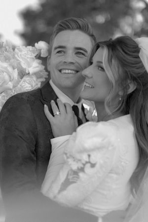 A romantic black and white wedding photo series showing tender moments between a bride and groom.