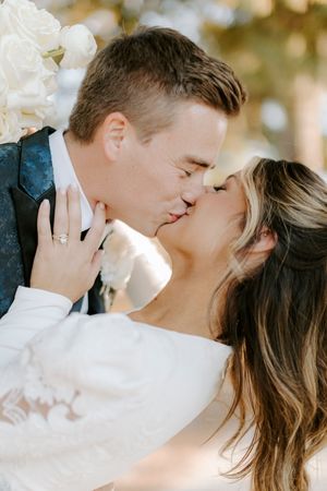 A romantic couple shares tender moments in a series of intimate wedding photos with soft natural lighting.