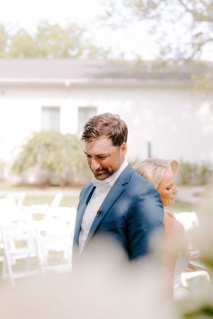 A series of candid photos show wedding guests sharing laughter and joyful moments at an outdoor celebration.