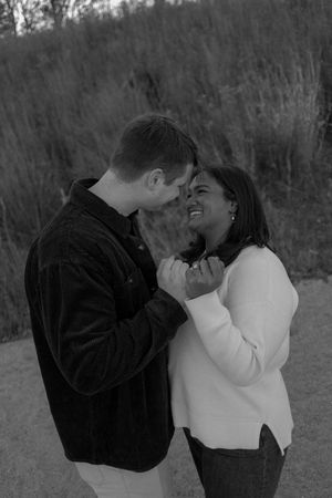 A romantic black and white photo sequence showing a couple sharing intimate moments outdoors in nature.
