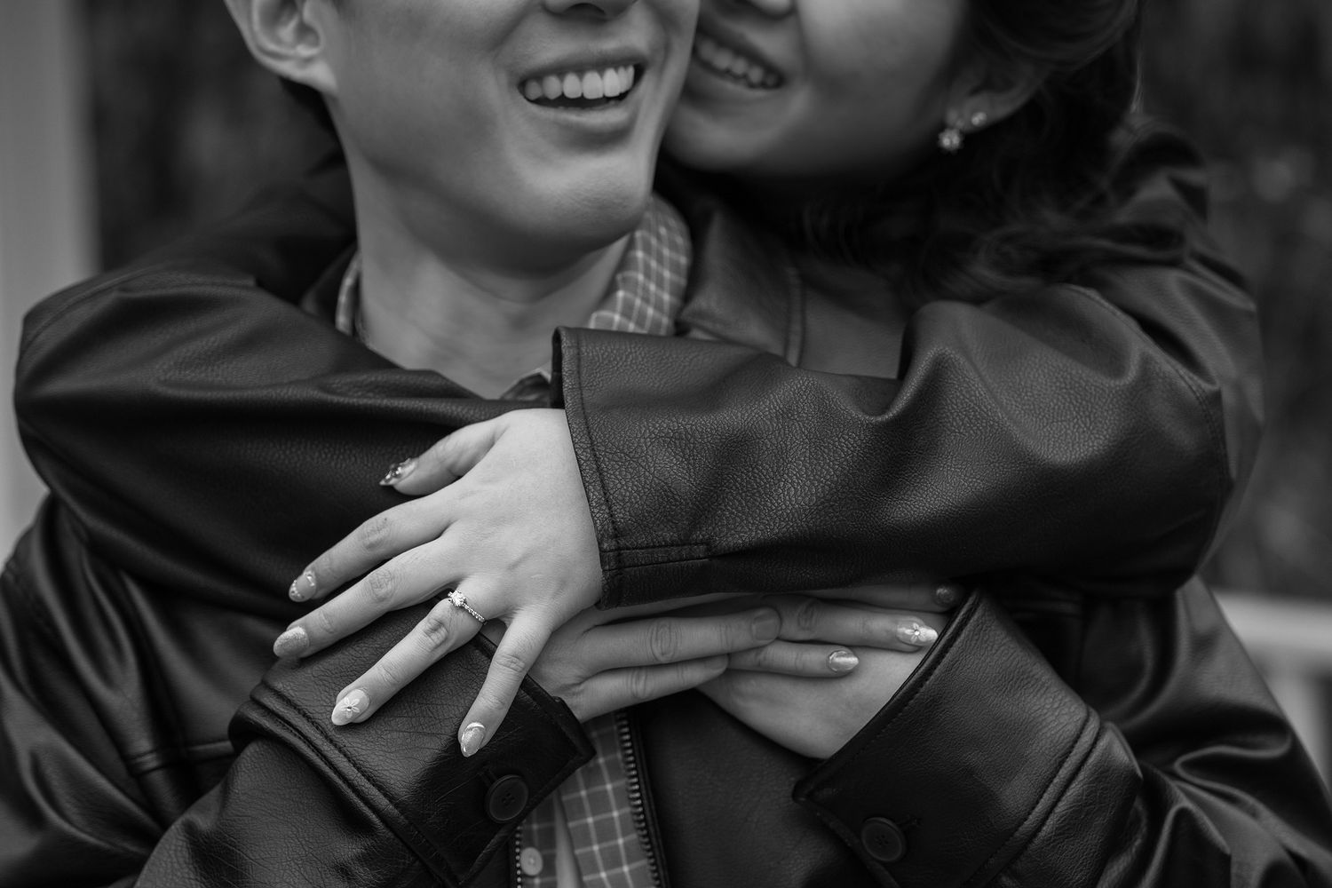 A black and white collage of candid moments showing people embracing and laughing together.