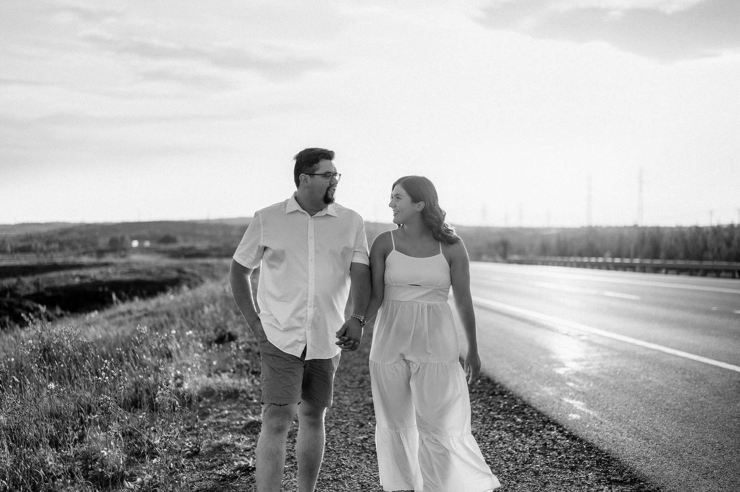 Beautiful rustic outdoor family photo session in a golden field at sunset.