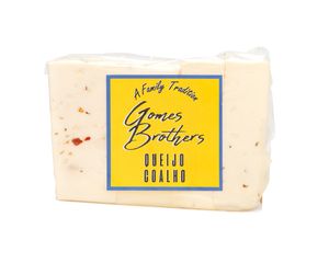 A block of yellow-labeled Brebirousse cheese with Gomez Brothers branding on the package.