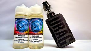 White bottles of wellness products and vaping devices arranged for product photography.