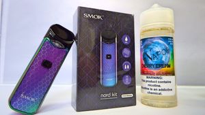 Collection of SMOK vaping devices and accessories displayed against a white background with purple gradient finishes.