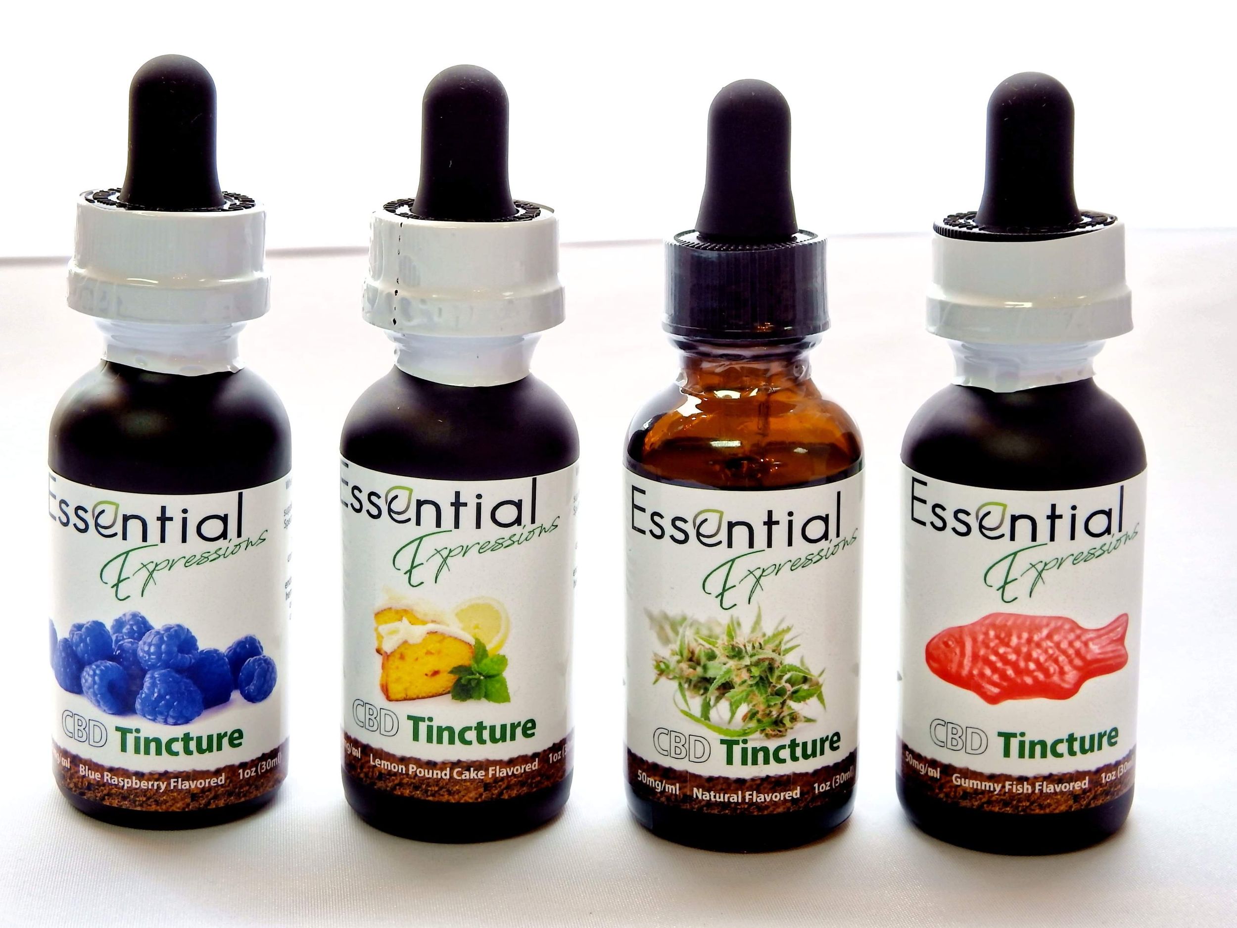 Lineup of essential oil and tincture bottles with varied colored labels and dropper caps.