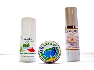Collection of essential oil bottles and wellness products with natural ingredient branding.