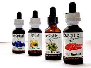 Collection of essential oil tincture bottles with dark glass droppers and natural product branding.