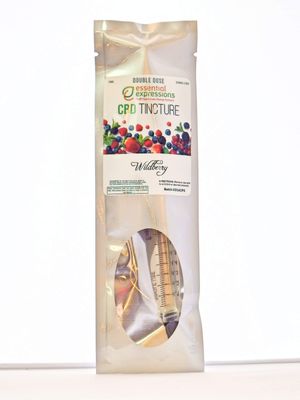 Product packaging pouches featuring colorful berry designs and CBD tincture branding.